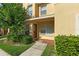 Charming townhome exterior with a well-maintained front yard and covered porch at 6250 Maisie Rd, Zephyrhills, FL 33542
