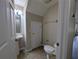 Cozy half-bathroom with pedestal sink, tile floors, and ample lighting at 6250 Maisie Rd, Zephyrhills, FL 33542