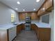 Updated kitchen with stainless steel appliances and modern countertops at 6250 Maisie Rd, Zephyrhills, FL 33542