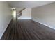 Spacious living room with new laminate flooring and ample natural light at 6250 Maisie Rd, Zephyrhills, FL 33542