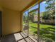 Screened patio offering views of the community landscaping and surrounding buildings at 6250 Maisie Rd, Zephyrhills, FL 33542