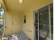 Enclosed lanai with door, siding door, and small window allows lots of light at 6250 Maisie Rd, Zephyrhills, FL 33542