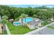 Aerial view of a pool with spa and ample lounge chairs at 6250 Maisie Rd, Zephyrhills, FL 33542