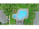 Aerial view of a pool and spa with lounge chairs at 6250 Maisie Rd, Zephyrhills, FL 33542