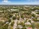 Aerial view of a property located in a lush, green neighborhood, offering easy access to surrounding areas at 653 E Spruce St, Tarpon Springs, FL 34689