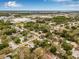 Aerial shot of the property nestled in a lush, green neighborhood with easy access to nearby bodies of water at 653 E Spruce St, Tarpon Springs, FL 34689