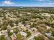 Property sits in a tree-filled neighborhood; the backyard features multiple structures and room to relax and play at 653 E Spruce St, Tarpon Springs, FL 34689