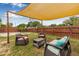 Relaxing backyard featuring shade sails, a privacy fence, and comfortable outdoor seating at 653 E Spruce St, Tarpon Springs, FL 34689