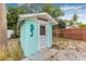 Exterior of a charming laundry room featuring a seahorse decoration at 653 E Spruce St, Tarpon Springs, FL 34689