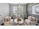 Comfortable living room with decorative wood wall, neutral furniture, stylish lighting, and lots of natural light at 7307 S Trask St, Tampa, FL 33616