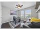 Bright home office with a modern desk, cityscape art, and a comfortable sofa, ideal for remote work and relaxation at 7307 S Trask St, Tampa, FL 33616