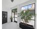 Enclosed patio with glass doors, tile flooring, and natural light at 7307 S Trask St, Tampa, FL 33616