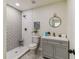 Tastefully decorated bathroom featuring contemporary fixtures, patterned tile, and a modern vanity with storage at 8704 N Brooks St, Tampa, FL 33604