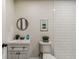 Clean bathroom showcasing modern fixtures, a subway-tiled shower, and a sleek vanity with contemporary design at 8704 N Brooks St, Tampa, FL 33604