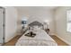 Well-lit bedroom featuring neutral tones, comfortable bedding, and a soothing ambiance for a restful retreat at 8704 N Brooks St, Tampa, FL 33604