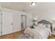 Bright bedroom with a comfortable bed, coordinated decor, and access to an ensuite bathroom at 8704 N Brooks St, Tampa, FL 33604