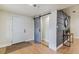 Stylish entryway showcasing gray barn door, modern accent wall, and durable laminate flooring at 8704 N Brooks St, Tampa, FL 33604