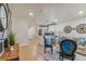 Inviting living room featuring an open floor plan, stylish decor, and seamless connection to the modern kitchen at 8704 N Brooks St, Tampa, FL 33604