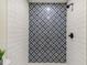 Bathroom shower with decorative tile, a modern shower head, and clean white subway tile at 8704 N Brooks St, Tampa, FL 33604