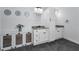 Well-lit bathroom with double sinks, granite countertops, and stylish decor at 8755 Ogleby Creek Rd, Myakka City, FL 34251