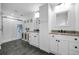 Spacious bathroom with double sinks, granite counters, and a shower/tub combo at 8755 Ogleby Creek Rd, Myakka City, FL 34251