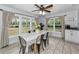 Inviting dining area with large windows and neutral tones, creating a warm and welcoming atmosphere at 8755 Ogleby Creek Rd, Myakka City, FL 34251