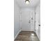 Bright entryway featuring neutral walls, tile flooring, and a white front door with sidelight at 8755 Ogleby Creek Rd, Myakka City, FL 34251