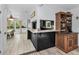 View of kitchen and bar area. Includes appliances, bar top, view to dining area at 8755 Ogleby Creek Rd, Myakka City, FL 34251