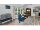 Sunlit living room showcasing views, comfortable seating, and a classic chess set at 8755 Ogleby Creek Rd, Myakka City, FL 34251