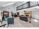 Spacious living room with fireplace, loft, bar, and ample seating for relaxing and entertaining at 8755 Ogleby Creek Rd, Myakka City, FL 34251