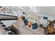 Open-concept living room with wood floors, a staircase, and modern decor at 8755 Ogleby Creek Rd, Myakka City, FL 34251
