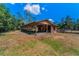 Large wooden outbuilding with multiple bays at 8755 Ogleby Creek Rd, Myakka City, FL 34251