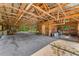 Interior view of large wooden outbuilding showcasing workbench and storage at 8755 Ogleby Creek Rd, Myakka City, FL 34251