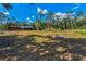 View of wooden outbuilding on lot at 8755 Ogleby Creek Rd, Myakka City, FL 34251