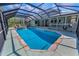 Beautiful screened pool and attached porch, showcasing the home's backyard at 8755 Ogleby Creek Rd, Myakka City, FL 34251