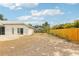The backyard includes a patio and a wooden fence adding both space to entertain and privacy at 9422 Clover Glen Dr, Riverview, FL 33569
