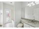 Bathroom features a modern vanity, toilet, and walk-in shower with a frosted glass door at 9422 Clover Glen Dr, Riverview, FL 33569