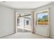 Bright bedroom with neutral carpets, large window, and sliding glass door to the patio at 9422 Clover Glen Dr, Riverview, FL 33569