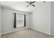 A simple bedroom boasts a ceiling fan and natural light from the window at 9422 Clover Glen Dr, Riverview, FL 33569