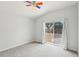 Bright bedroom with access to back patio and a ceiling fan at 9422 Clover Glen Dr, Riverview, FL 33569