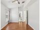 Bedroom with wood flooring, a ceiling fan and an ensuite bathroom at 9422 Clover Glen Dr, Riverview, FL 33569