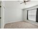 Neutral bedroom featuring a ceiling fan and a window with simple curtains at 9422 Clover Glen Dr, Riverview, FL 33569