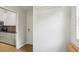 View of the hallway showcasing a door and white wire shelving unit at 9422 Clover Glen Dr, Riverview, FL 33569