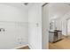 Bright laundry room with white walls and a hookup for a washing machine at 9422 Clover Glen Dr, Riverview, FL 33569