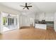 Open-concept living room with wood floors and a view of the outdoor patio at 9422 Clover Glen Dr, Riverview, FL 33569