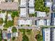 Aerial view of condo community showcasing the property's layout, parking, and neighborhood at 946 Highland Ave # 24, Dunedin, FL 34698