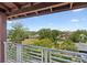 Balcony view overlooking lush green trees and shrubs in a beautiful courtyard at 946 Highland Ave # 24, Dunedin, FL 34698