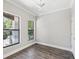 Bright bedroom features hardwood floors, neutral paint, and natural light at 946 Highland Ave # 24, Dunedin, FL 34698