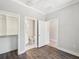 Bright bedroom boasts a walk-in closet, attached bath with white tile and modern vanity with hard wood floors at 946 Highland Ave # 24, Dunedin, FL 34698