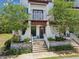 Attractive entryway with brick planters, modern white handrails, and steps leading to the front door at 946 Highland Ave # 24, Dunedin, FL 34698